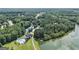Picturesque aerial view of the community with amenities including pool, lake, and tennis courts surrounded by lush trees at 185 Discovery Lake Dr, Fayetteville, GA 30215