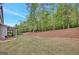 Expansive backyard featuring lush lawn and wooded area, perfect for outdoor activities and enjoying nature at 185 Discovery Lake Dr, Fayetteville, GA 30215