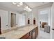 Elegant bathroom featuring a double vanity with granite countertops and ample lighting, and a view to a bedroom at 185 Discovery Lake Dr, Fayetteville, GA 30215