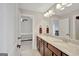 Stylish bathroom with a double sink vanity, granite countertops, and modern fixtures, creating a functional space at 185 Discovery Lake Dr, Fayetteville, GA 30215