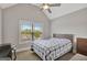 Cozy bedroom with a plush bed, a window offering natural light, and neutral décor creating a serene space at 185 Discovery Lake Dr, Fayetteville, GA 30215