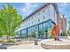 Modern building exterior with vibrant architectural details, outdoor seating and beautiful landscaping at 185 Discovery Lake Dr, Fayetteville, GA 30215