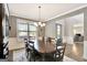 Formal dining area featuring a large wooden table, chairs, and views into the study at 185 Discovery Lake Dr, Fayetteville, GA 30215