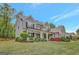 Charming two-story home boasts a manicured lawn and inviting front porch at 185 Discovery Lake Dr, Fayetteville, GA 30215