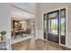 Grand foyer with hardwood floors, a dining area, and natural light streaming through the front door at 185 Discovery Lake Dr, Fayetteville, GA 30215