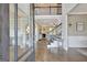 Spacious foyer featuring hardwood floors, stairs, and views into the living room at 185 Discovery Lake Dr, Fayetteville, GA 30215