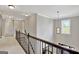 Upstairs hallway with carpet floors, overhead lights, and a railing at 185 Discovery Lake Dr, Fayetteville, GA 30215