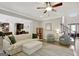 Spacious living room featuring hardwood floors, stylish furniture, and an open layout to the kitchen at 185 Discovery Lake Dr, Fayetteville, GA 30215