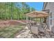 Inviting outdoor patio area with ample seating and dining, perfect for enjoying meals and entertaining guests at 185 Discovery Lake Dr, Fayetteville, GA 30215