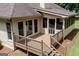 Expansive back deck features railings and access to a screened-in porch at 280 Ridgemont Dr, Fayetteville, GA 30215