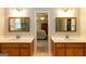 This bathroom features a dual vanity with a mirror, and an entry to the main bedroom at 280 Ridgemont Dr, Fayetteville, GA 30215