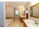 This bathroom features a jacuzzi tub and a dual vanity with white countertops at 280 Ridgemont Dr, Fayetteville, GA 30215
