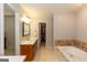 This bathroom features a jacuzzi tub and a vanity with white countertops at 280 Ridgemont Dr, Fayetteville, GA 30215