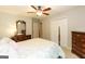 Bedroom with a ceiling fan, wooden furniture, and white closet doors at 280 Ridgemont Dr, Fayetteville, GA 30215