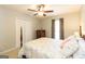 Bedroom with light colored walls, a ceiling fan, and a four-poster bed at 280 Ridgemont Dr, Fayetteville, GA 30215