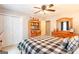 Bedroom featuring white closet doors, a bookcase, and light colored walls at 280 Ridgemont Dr, Fayetteville, GA 30215