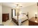 Bedroom featuring wooden furniture, a four-poster bed, and a ceiling fan at 280 Ridgemont Dr, Fayetteville, GA 30215