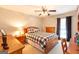 Cozy bedroom featuring a buffalo check comforter, a ceiling fan, and wood furniture at 280 Ridgemont Dr, Fayetteville, GA 30215