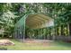 Carport structure featuring gravel, grass and shade at 280 Ridgemont Dr, Fayetteville, GA 30215