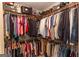 Walk-in closet with hanging clothes and shelving, maximizing storage space at 280 Ridgemont Dr, Fayetteville, GA 30215