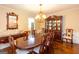 Spacious dining area with hardwood floors, a large table, and a classic china cabinet at 280 Ridgemont Dr, Fayetteville, GA 30215