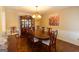 Traditional dining room featuring a large wooden table, chandelier, and ample seating for formal gatherings at 280 Ridgemont Dr, Fayetteville, GA 30215