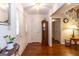 Bright foyer with hardwood floors, coat closet, and staircase at 280 Ridgemont Dr, Fayetteville, GA 30215