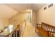 Bright, carpeted upstairs hallway featuring a bench seat, ceiling fan, and view to the living room below at 280 Ridgemont Dr, Fayetteville, GA 30215