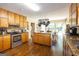 Bright eat-in kitchen with stainless steel appliances, a center island, and hardwood floors at 280 Ridgemont Dr, Fayetteville, GA 30215