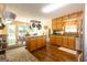 Spacious kitchen with stainless steel appliances, wood cabinets, and hardwood floors at 280 Ridgemont Dr, Fayetteville, GA 30215