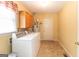Practical laundry room with washer, dryer, utility sink, water heater, and exterior access door at 280 Ridgemont Dr, Fayetteville, GA 30215