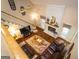 Living room highlights a brick fireplace, hardwood floors, ceiling fan, and comfortable leather furniture at 280 Ridgemont Dr, Fayetteville, GA 30215