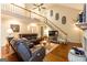 Open-concept living room with vaulted ceilings and a fireplace at 280 Ridgemont Dr, Fayetteville, GA 30215
