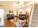 Spacious living room with a ceiling fan, stairs, and hardwood floors for a cozy atmosphere at 280 Ridgemont Dr, Fayetteville, GA 30215