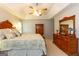 This main bedroom features a dresser, decor, and a large bed with stylish bedding at 280 Ridgemont Dr, Fayetteville, GA 30215