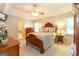 This is a spacious main bedroom featuring a ceiling fan, a dresser, and bedside lamps at 280 Ridgemont Dr, Fayetteville, GA 30215
