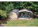 View of the outbuilding with a covered car port and storage shed at 280 Ridgemont Dr, Fayetteville, GA 30215