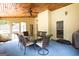 Screened-in porch featuring wooden ceilings, a ceiling fan, and patio seating area at 280 Ridgemont Dr, Fayetteville, GA 30215