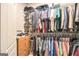 Well-organized walk-in closet with ample storage space and custom shelving at 1209 Persimmon Way, Mcdonough, GA 30252