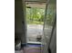 Back porch showing wood flooring and backyard at 7128 Lady Heidi Ct, Jonesboro, GA 30236