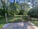 Wooden porch overlooking a lush backyard with mature trees at 7128 Lady Heidi Ct, Jonesboro, GA 30236