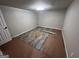 Large, open basement space with gray flooring, ready for new owner to personalize at 7128 Lady Heidi Ct, Jonesboro, GA 30236