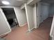 Finished basement area with doorway to new bathroom, ready for personalization at 7128 Lady Heidi Ct, Jonesboro, GA 30236