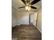 Bedroom with light gray walls, ceiling fan and wood-look flooring at 7128 Lady Heidi Ct, Jonesboro, GA 30236