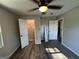 Bedroom featuring gray walls, two doors, and luxury vinyl plank flooring at 7128 Lady Heidi Ct, Jonesboro, GA 30236