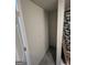 Bare closet space features gray floor tiles next to the shower area at 7128 Lady Heidi Ct, Jonesboro, GA 30236