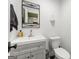 Compact bathroom with a modern sink vanity and toilet at 2944 Braithwood Ne Ct, Atlanta, GA 30345