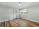 This bedroom has hardwood floors, a ceiling fan, closet space, and lots of natural light at 2944 Braithwood Ne Ct, Atlanta, GA 30345
