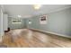 This bedroom has hardwood floors, neutral walls, and natural light from the windows at 2944 Braithwood Ne Ct, Atlanta, GA 30345