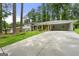 Charming exterior of home with lush landscaping, long driveway and inviting front porch at 2944 Braithwood Ne Ct, Atlanta, GA 30345